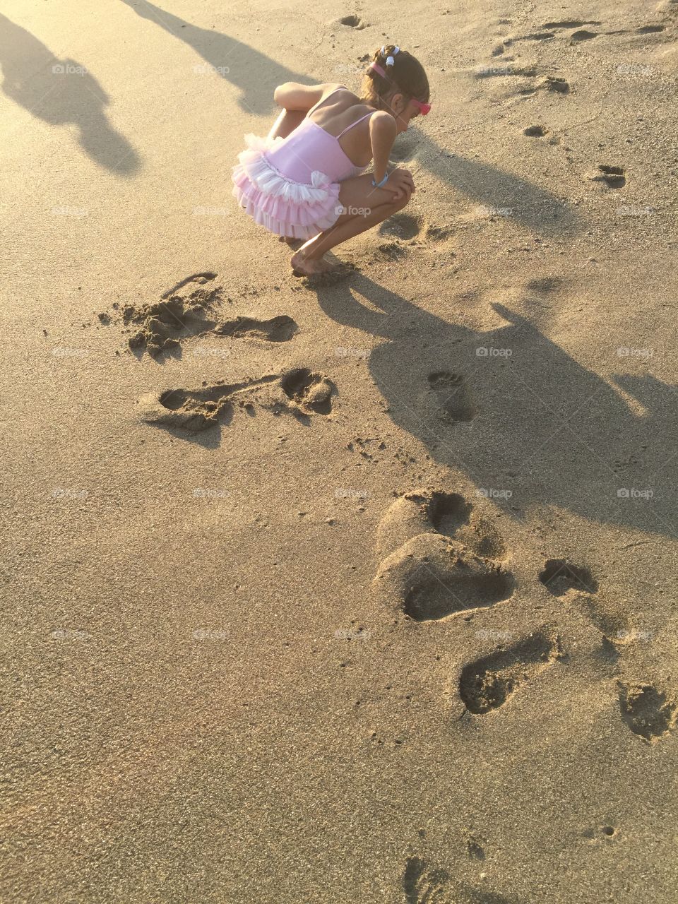 Last summer... looking for seashells on the beach is a favorite activity for all children
