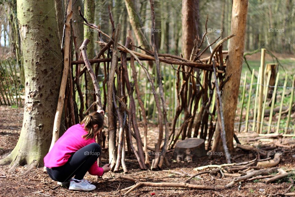 Den building in the woods 