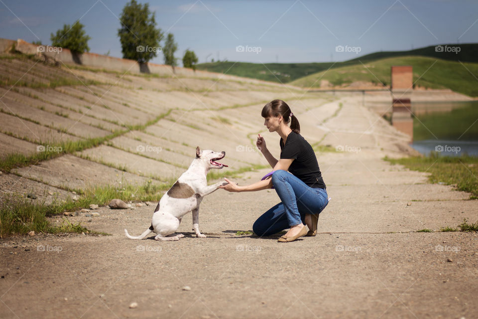 Girl playing with her dog