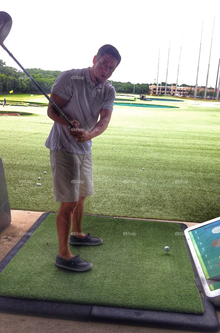 My Golfer. Man golfing at Top Golf