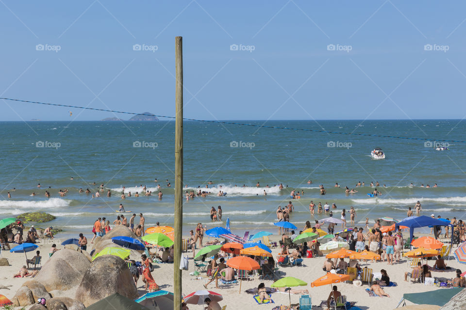 Tourists enjoy the summer on the little beach in Barra da Lagoa in Florianopolis Santa Catarina Brazil.