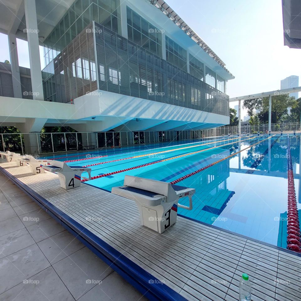 the pool area has been prepared for the swimming competition.  The swimming track has been installed in the pool and the championship is ready to start