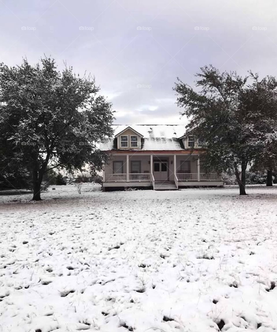 Texas farmhouse in the snow 