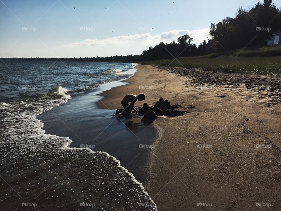 Boy playing on beach