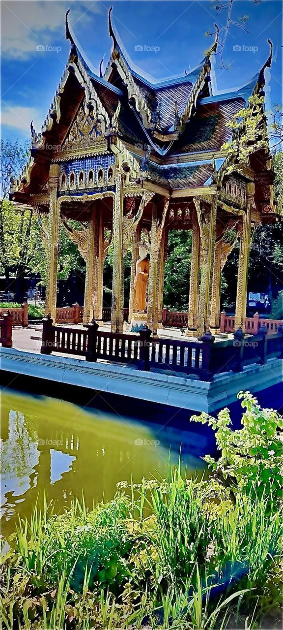 A breathtakingly beautiful free standing “Thai Sala” pagoda in “Munich’s” “Westpark” houses the first consecrated “Gautama Buddha” statue in Germany. This is one of 23 original gardens of the “International Garden Expo 83”. 2022. Hypnotic Productions