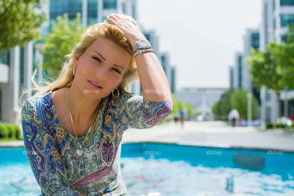 Portrait of a young woman in city