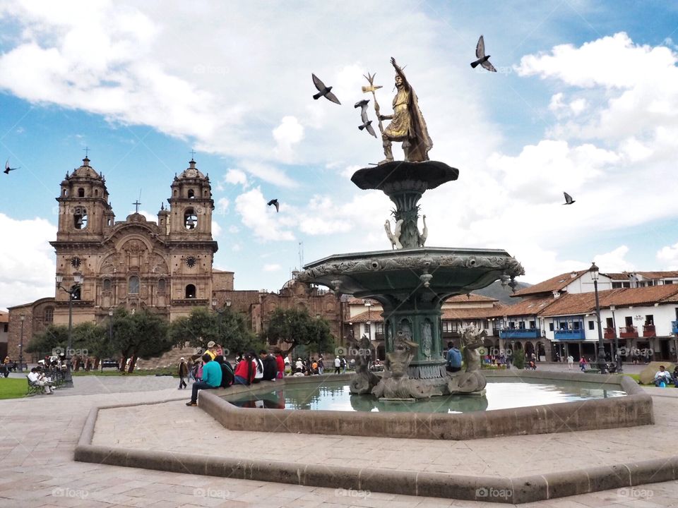 Peaceful side of Cuzco , Peru with flying pigeons and sunshine 