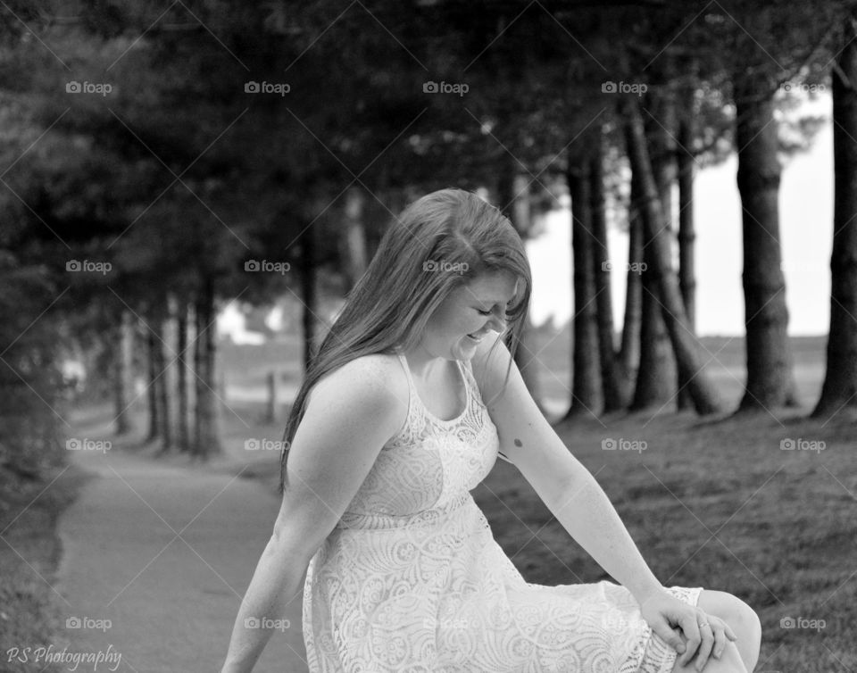 teenage girl. teenage girl can't keep from laughing during photo shoot