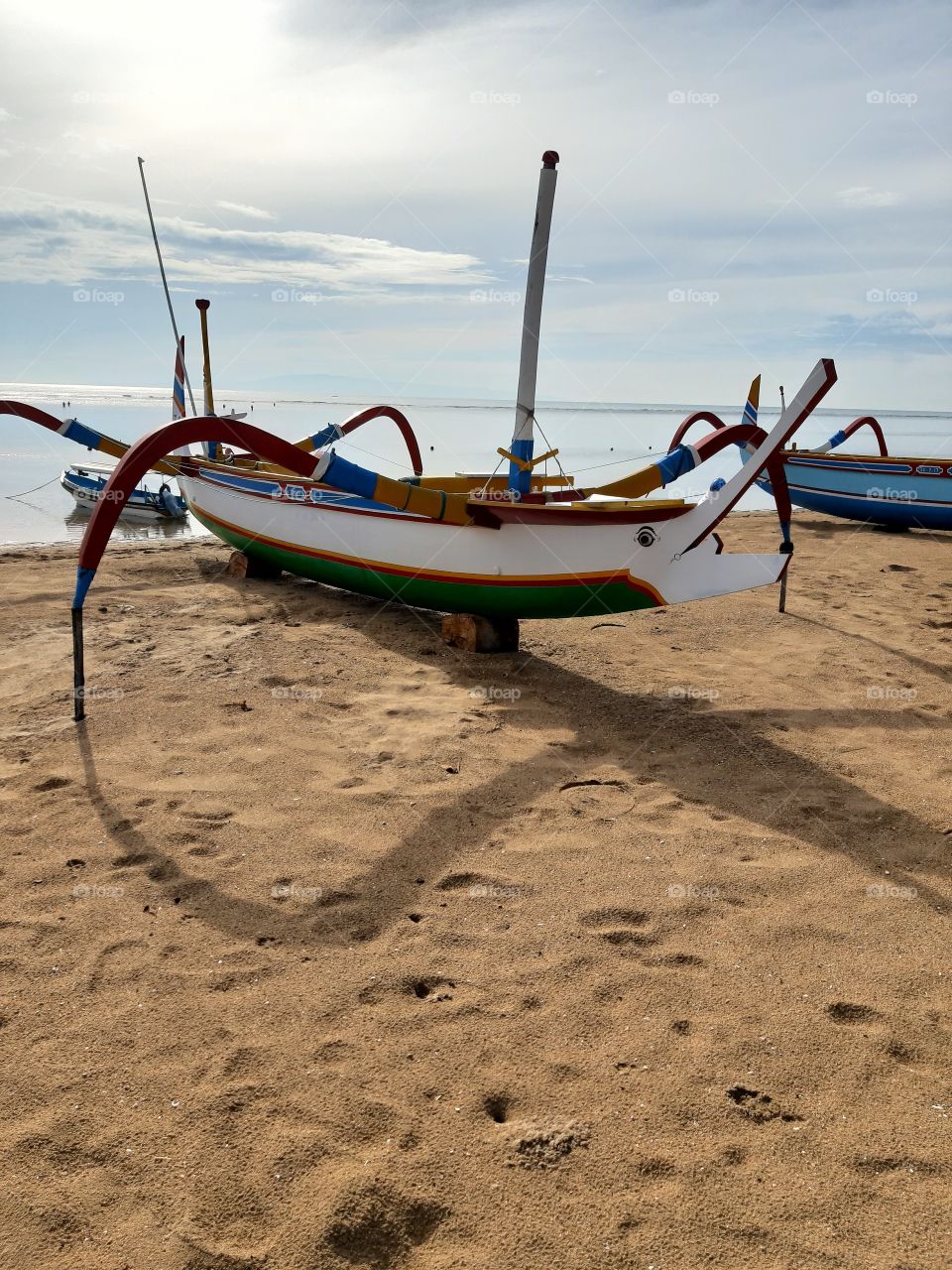 A fishing boat that found in Sanur Beach that located in Bali. This fishing boat was made of a strong big wood and painted with full of colors