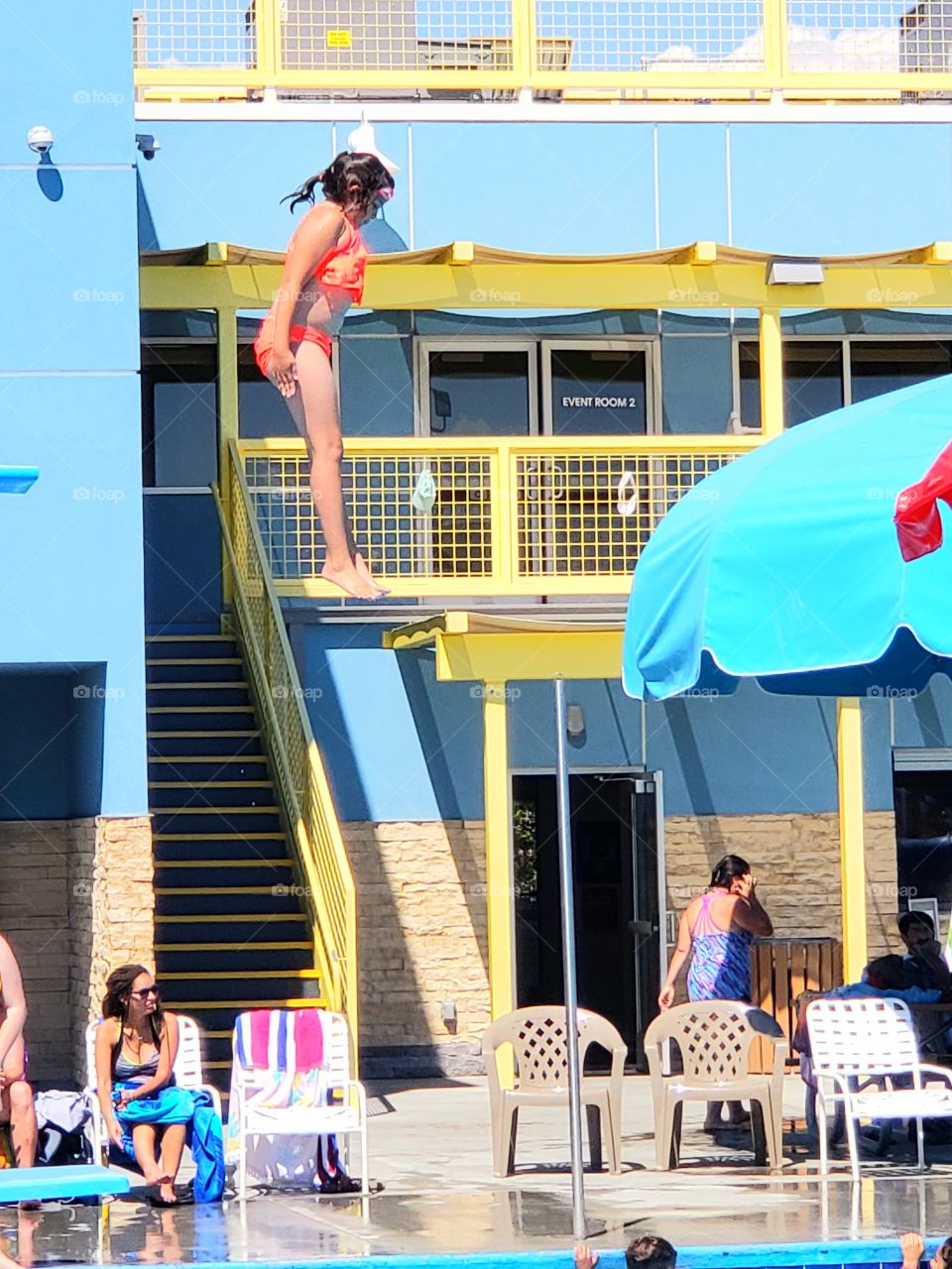 jumping into the pool off the high board