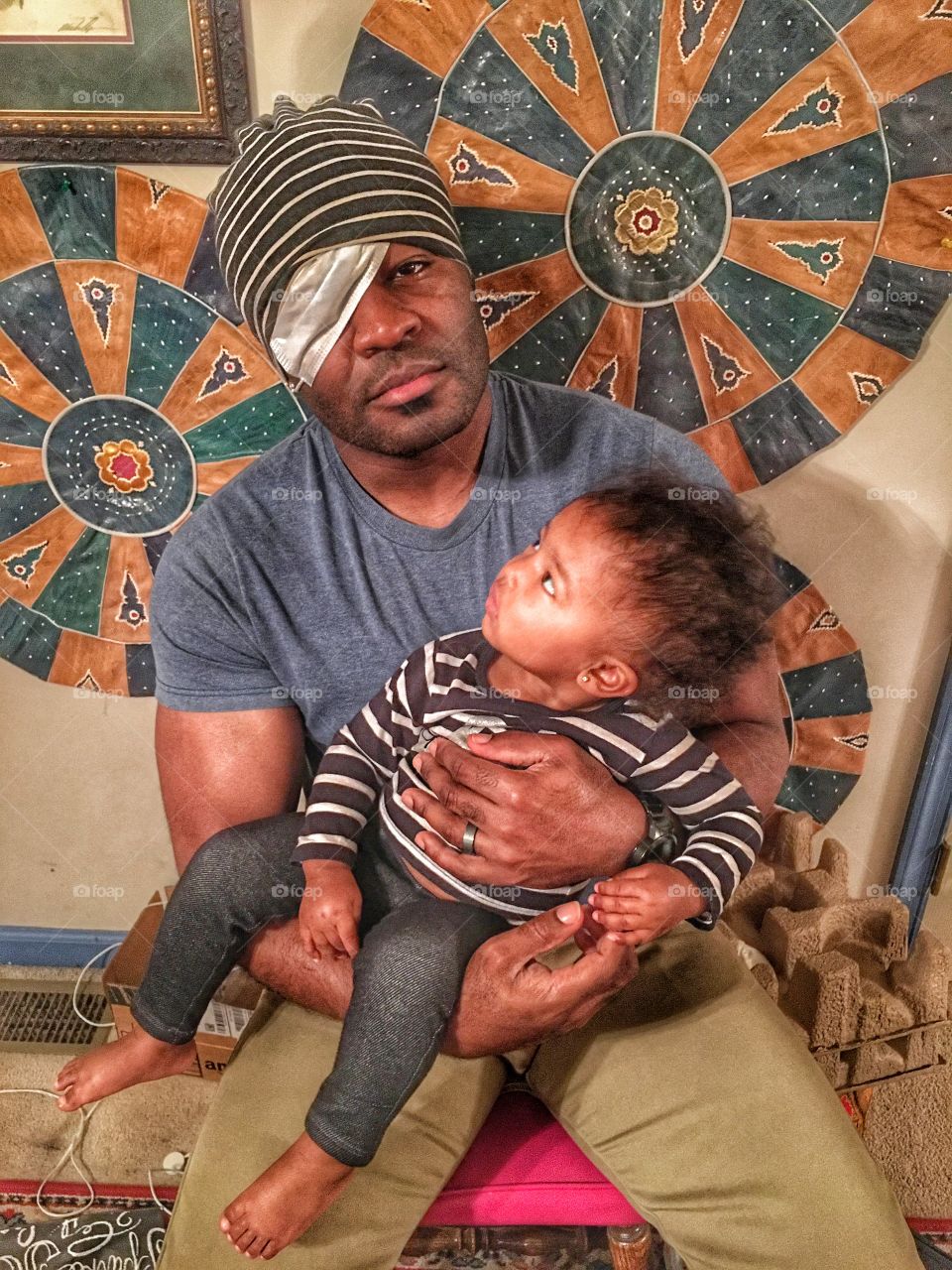 Wounded man carrying his child