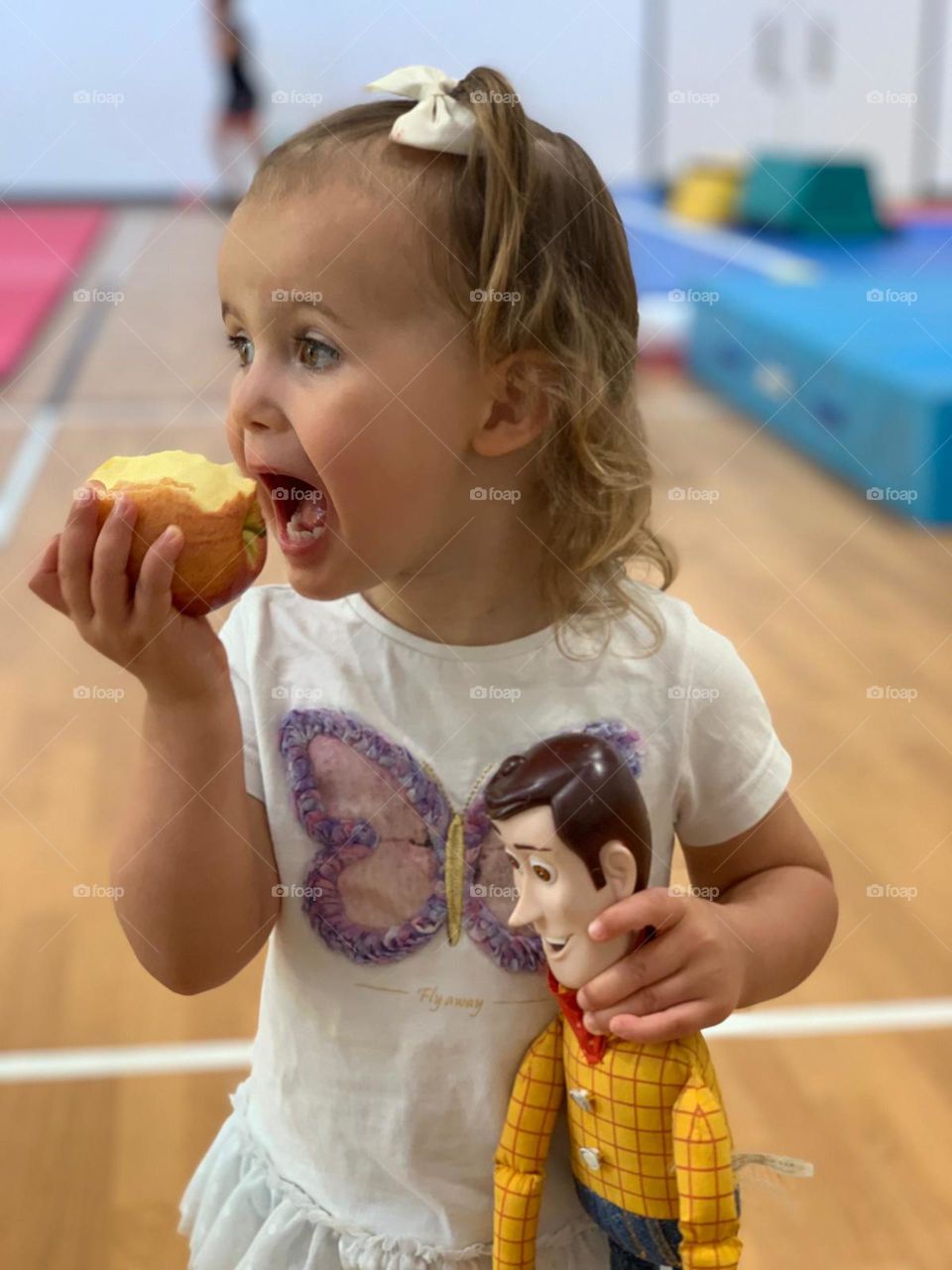 Little girl eating a Apple 