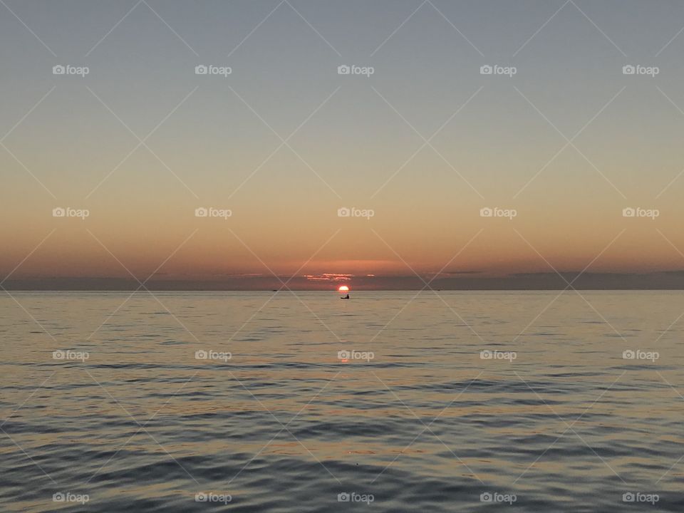 Lone kayaker during sunset