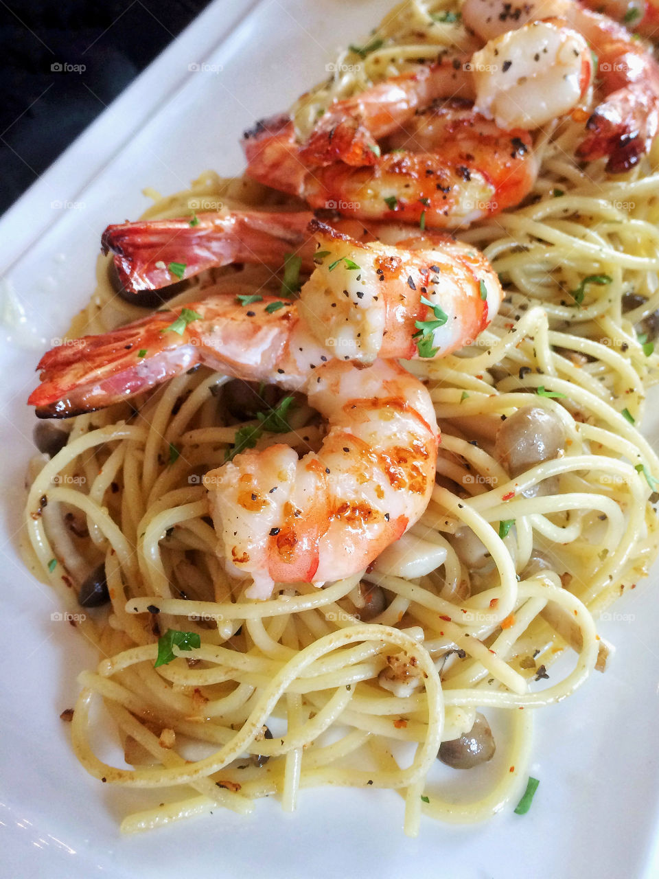 Pasta served with succulent prawns.