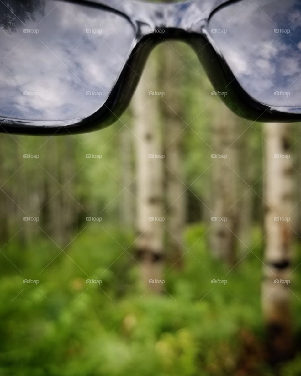 I am here in the mountains of the east taken pictures of the beautiful nature that we can see you can also see the skys and clouds through my glasses.