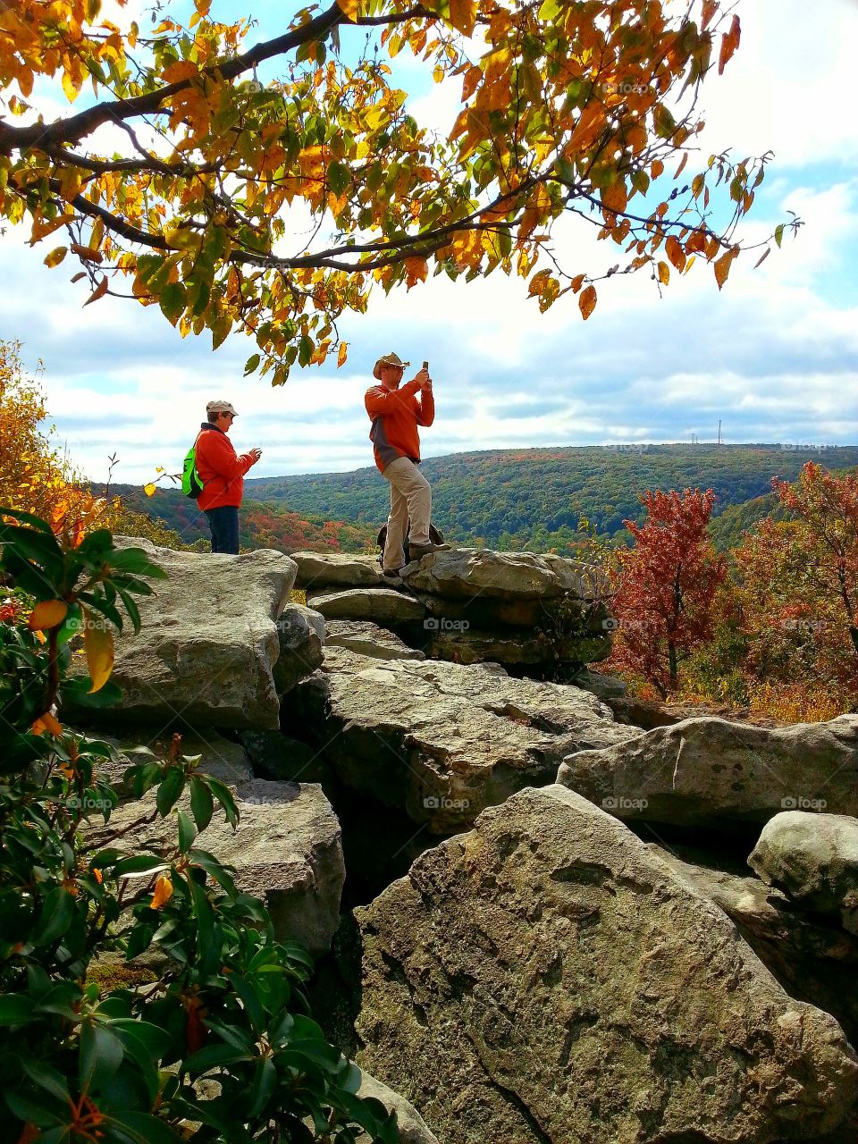 Photographing a colorful mountain overlook on a sunny autumn day.