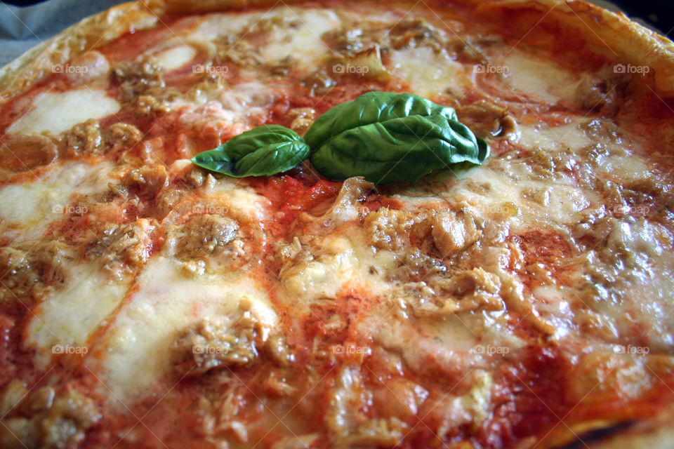 Italian pizza with tuna fish and onion