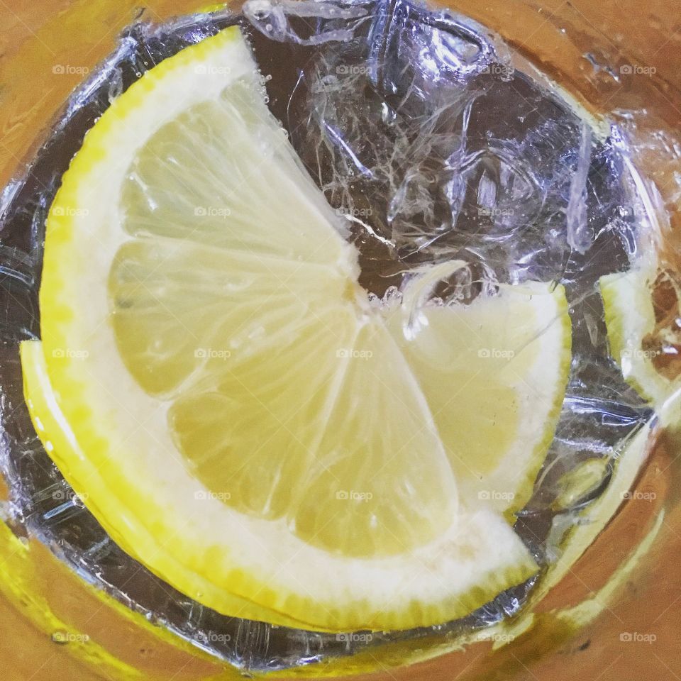 Gordons gin and tonic with fresh sliced lemon