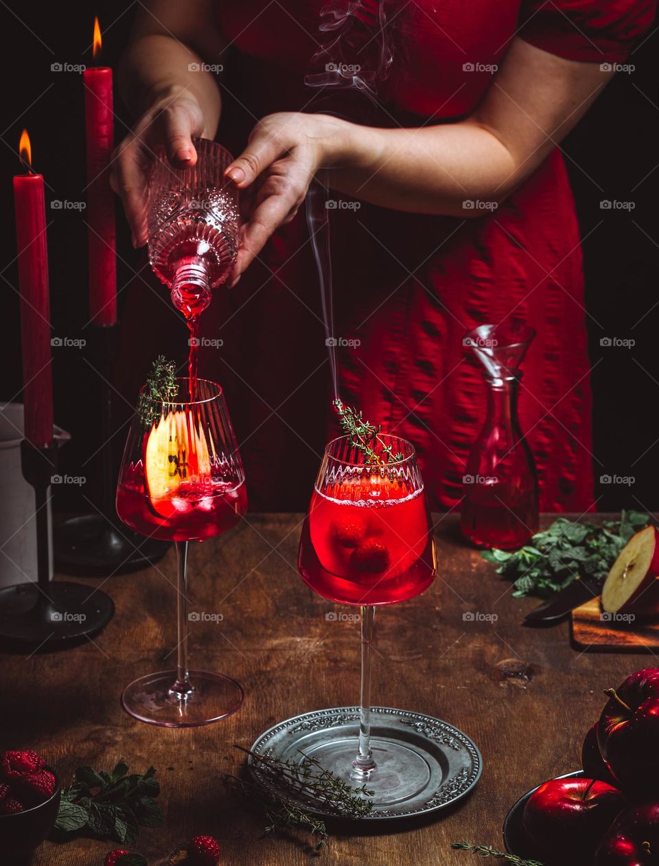 woman is preparing alcoholic drink in red colour