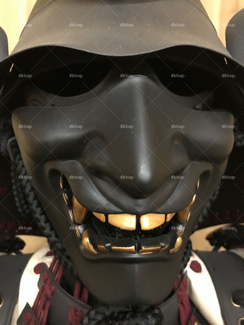 A close-up view of a samurai menpo. It definitely shows a joyous facial expression when one gets up close and personal.