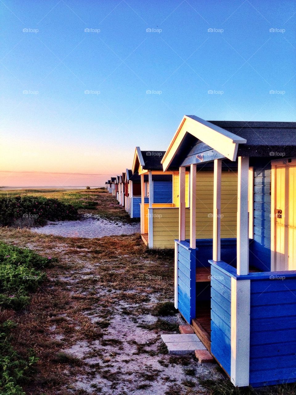 Beach huts in sunset