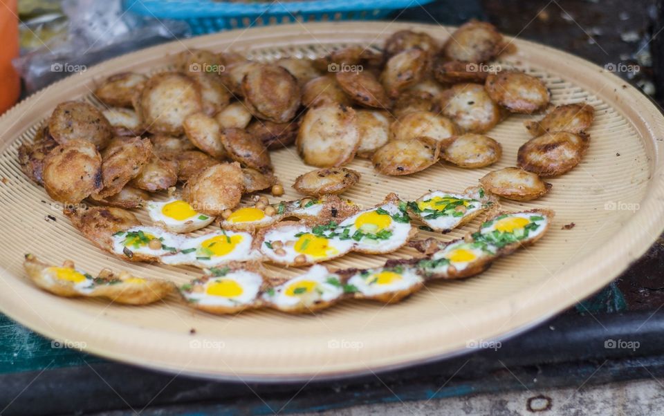 Street food at Yangon, Myanmar. Quail Egg Omelettes.