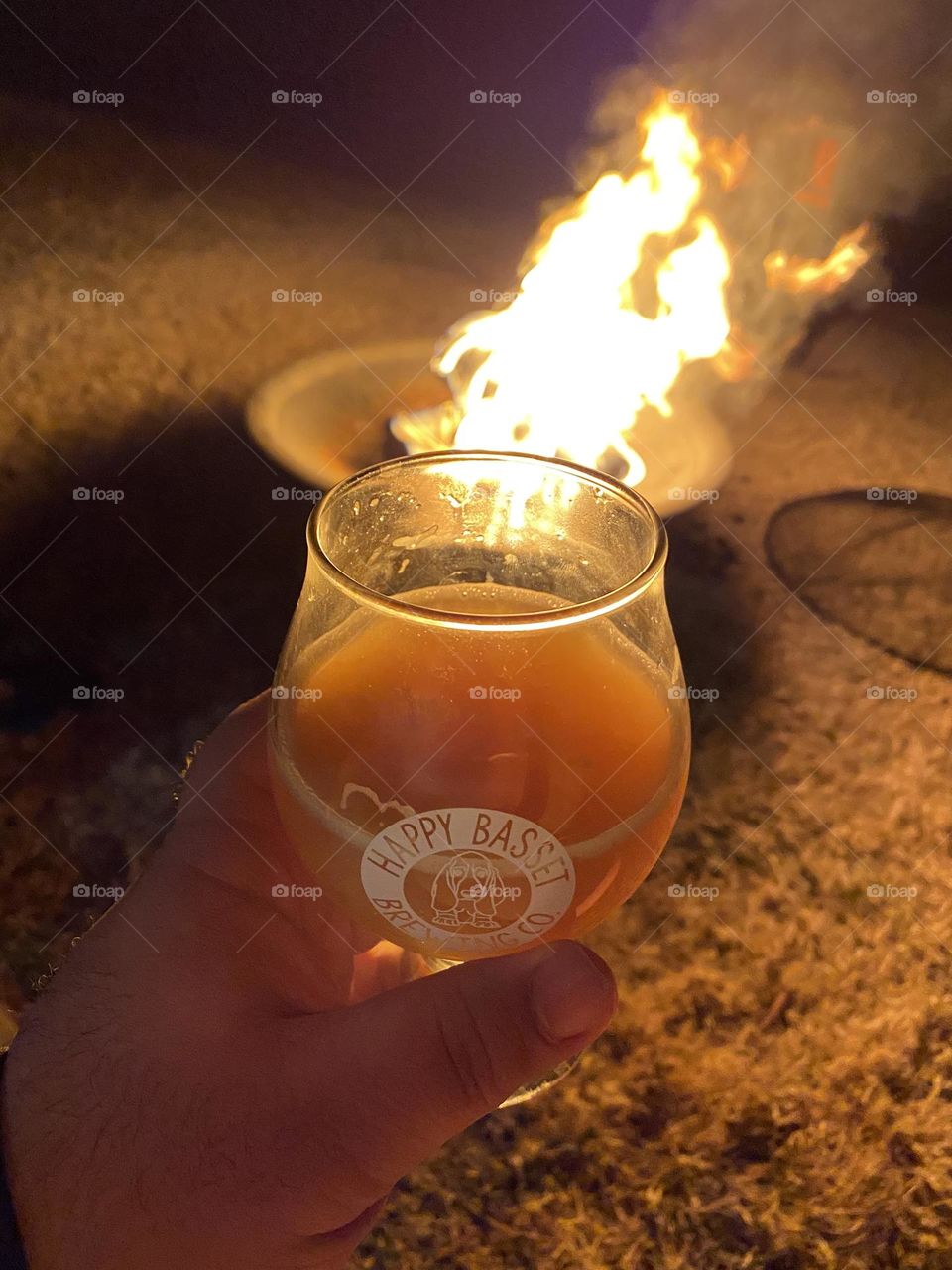Beer by the side of a fire.