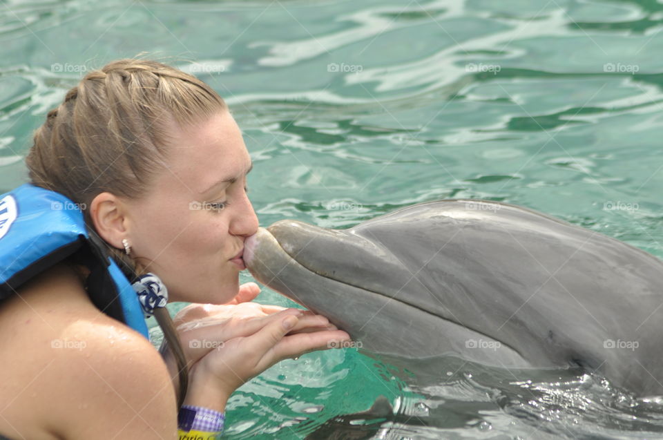 Kissing a dolphin