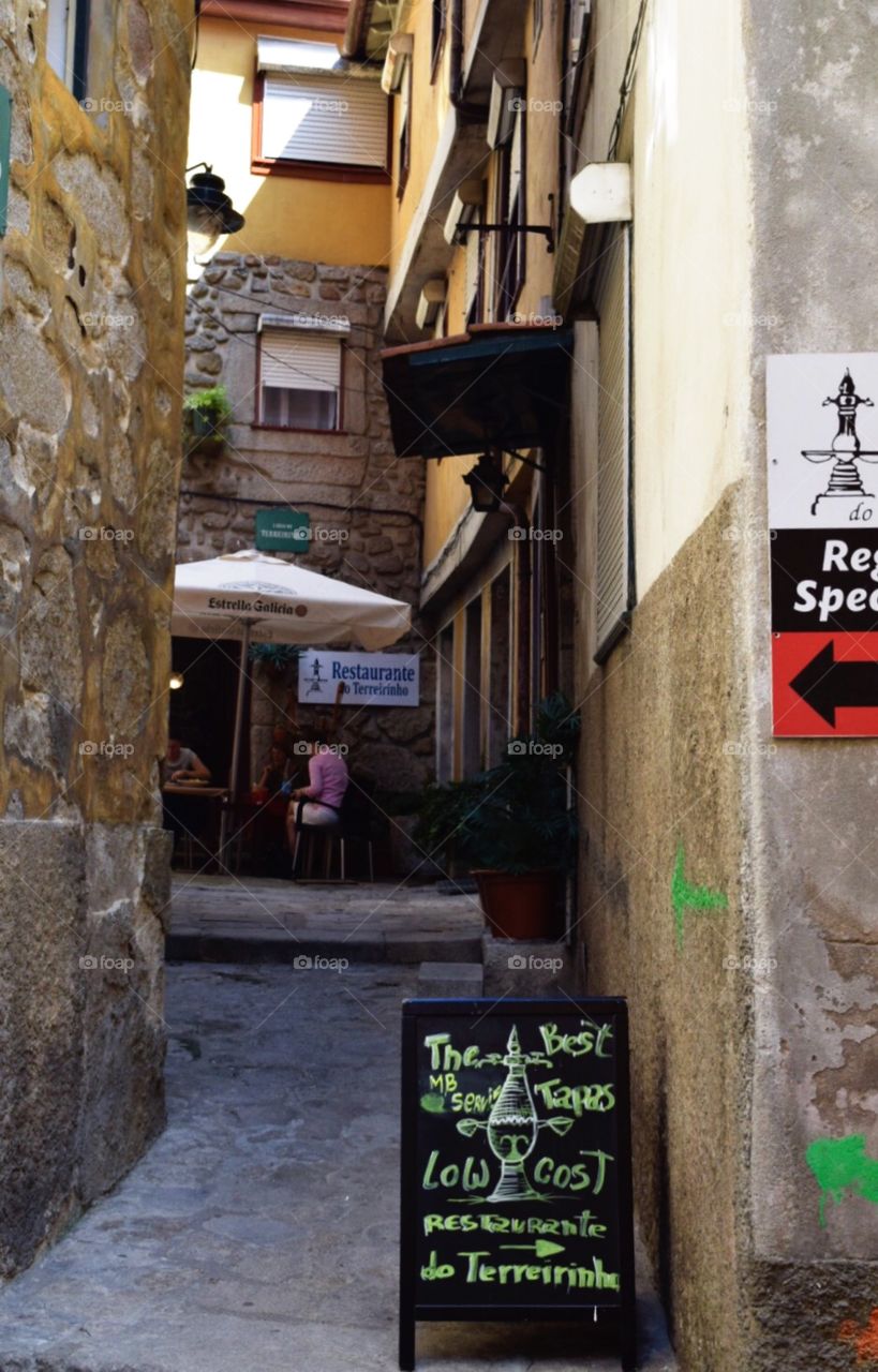 Restaurant in a narrow street of porto 