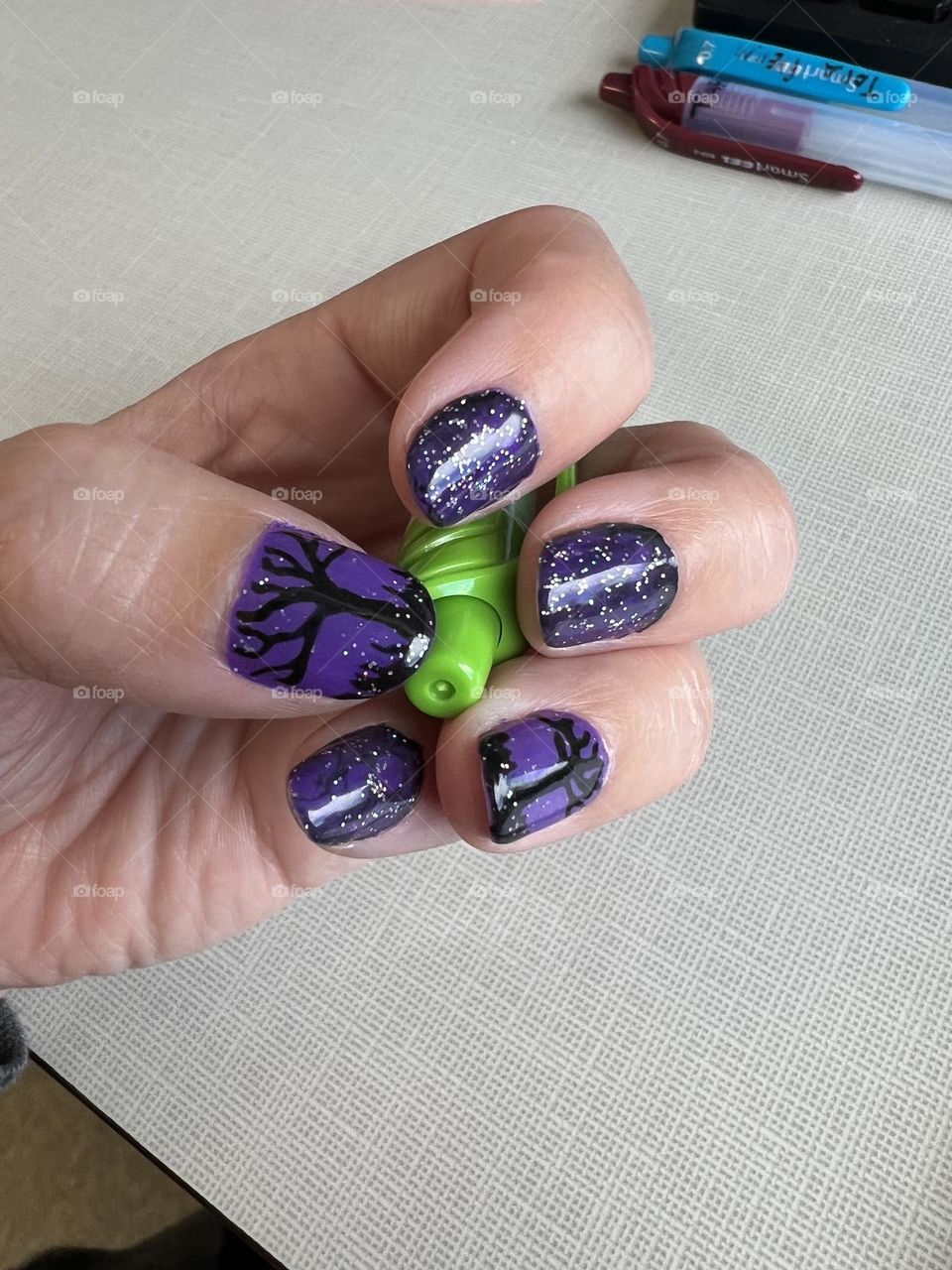 A spooky purple Halloween nail art design 