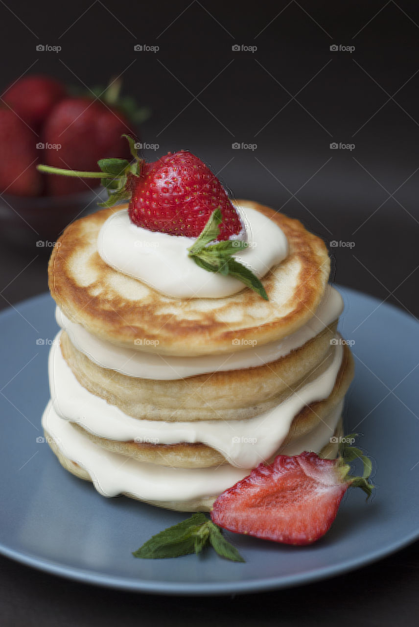 Homemade dessert: american pancakes with strawberry.