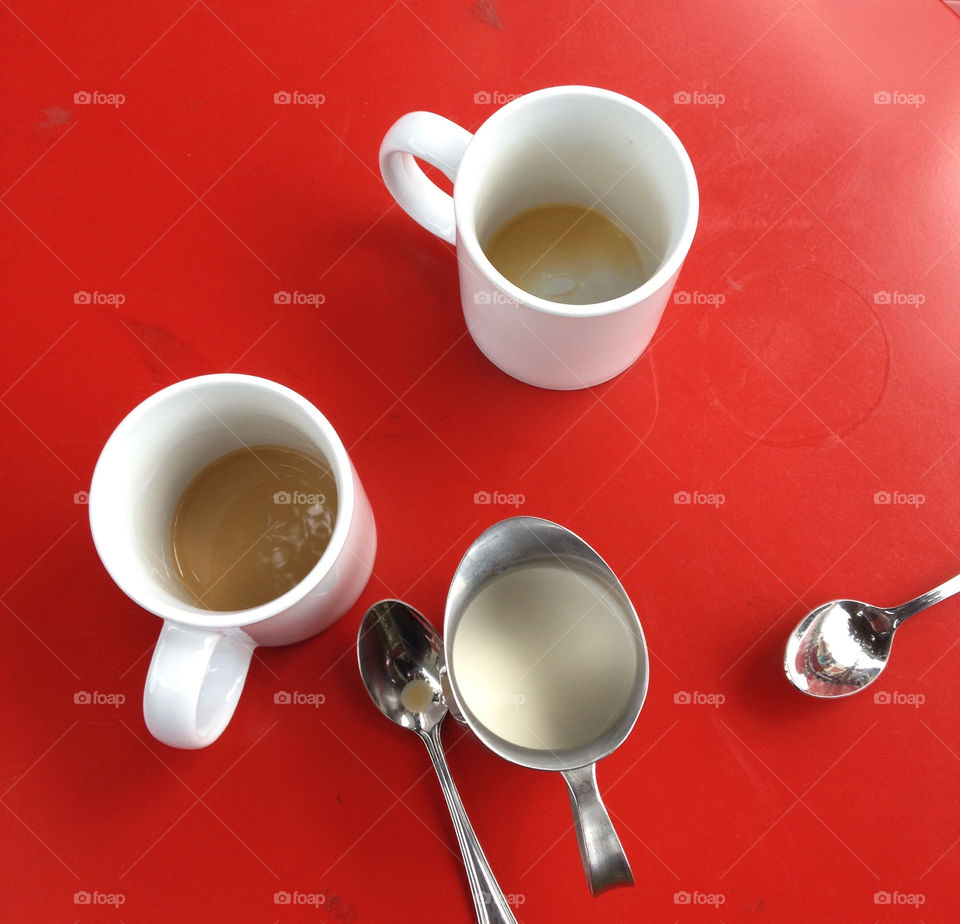 Used Coffee Mugs On A Red Cafe Table