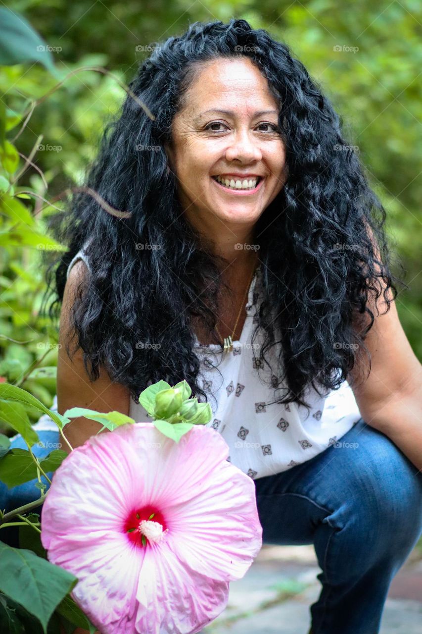 Beautiful lady with long black hair smiling