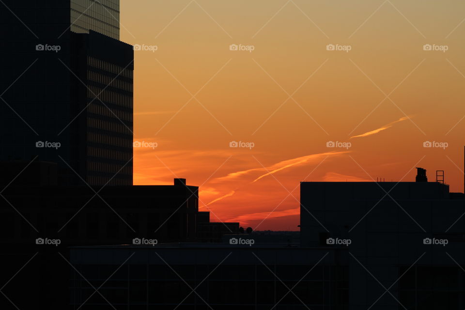 Silhouette of building against dramatic sky