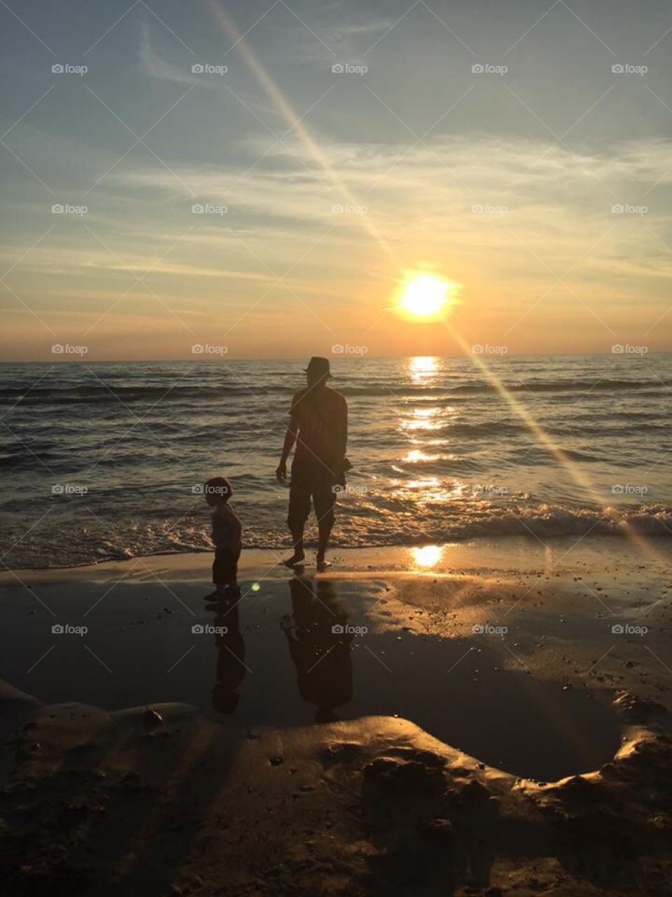 Father and Son on the Beach at Sunset 