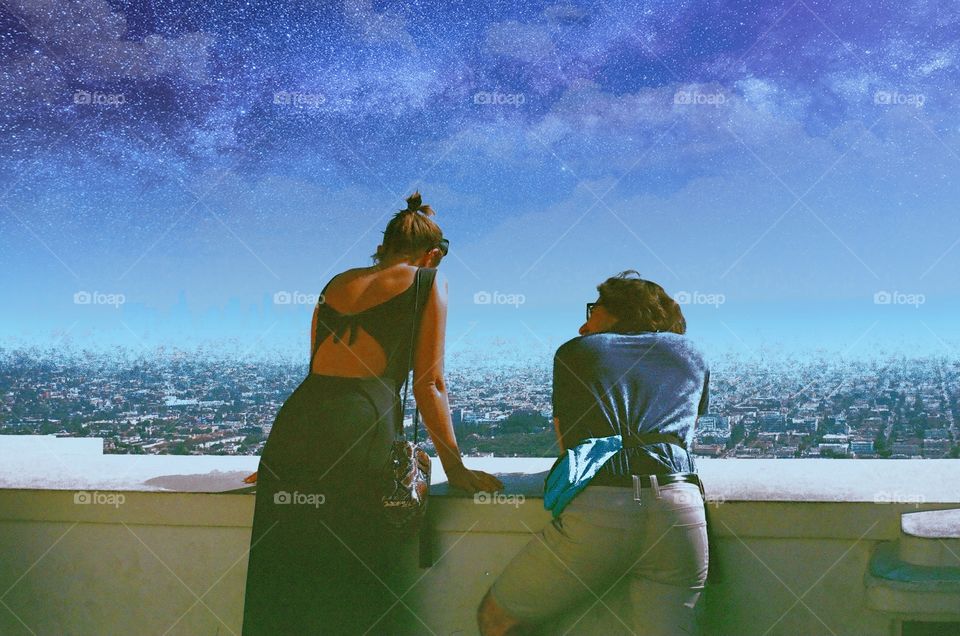 man and woman on building under the blue sky