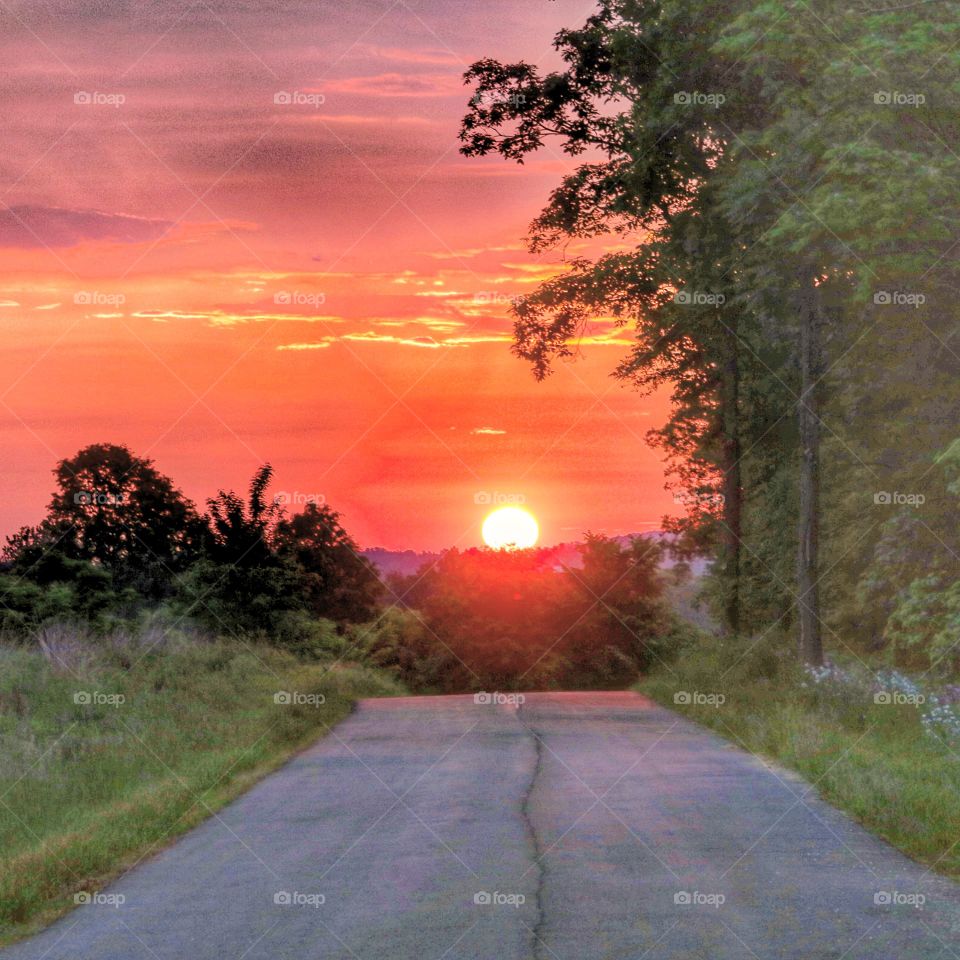 down a country road at sunrise