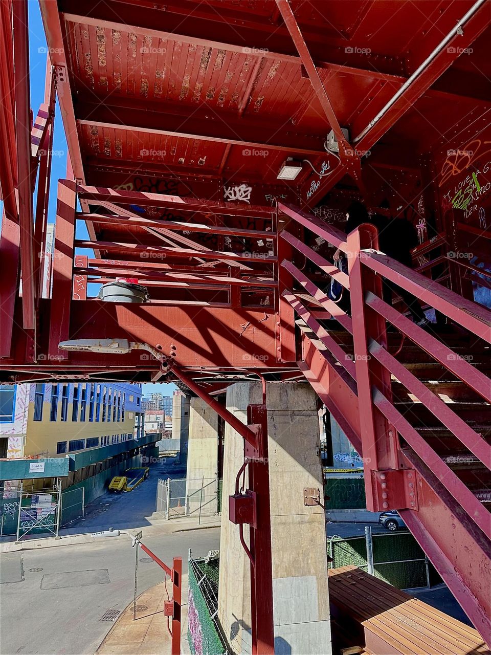 These are the “Bauhaus” inspired red metal stairs of the “Pulaski Bridge” at “Newtown Creek” in “Greenpoint”, Bklyn. The sun casts strong shadows onto its structures that combine with the shapes to create delicate patterns. 2024. Hypnotic Productions