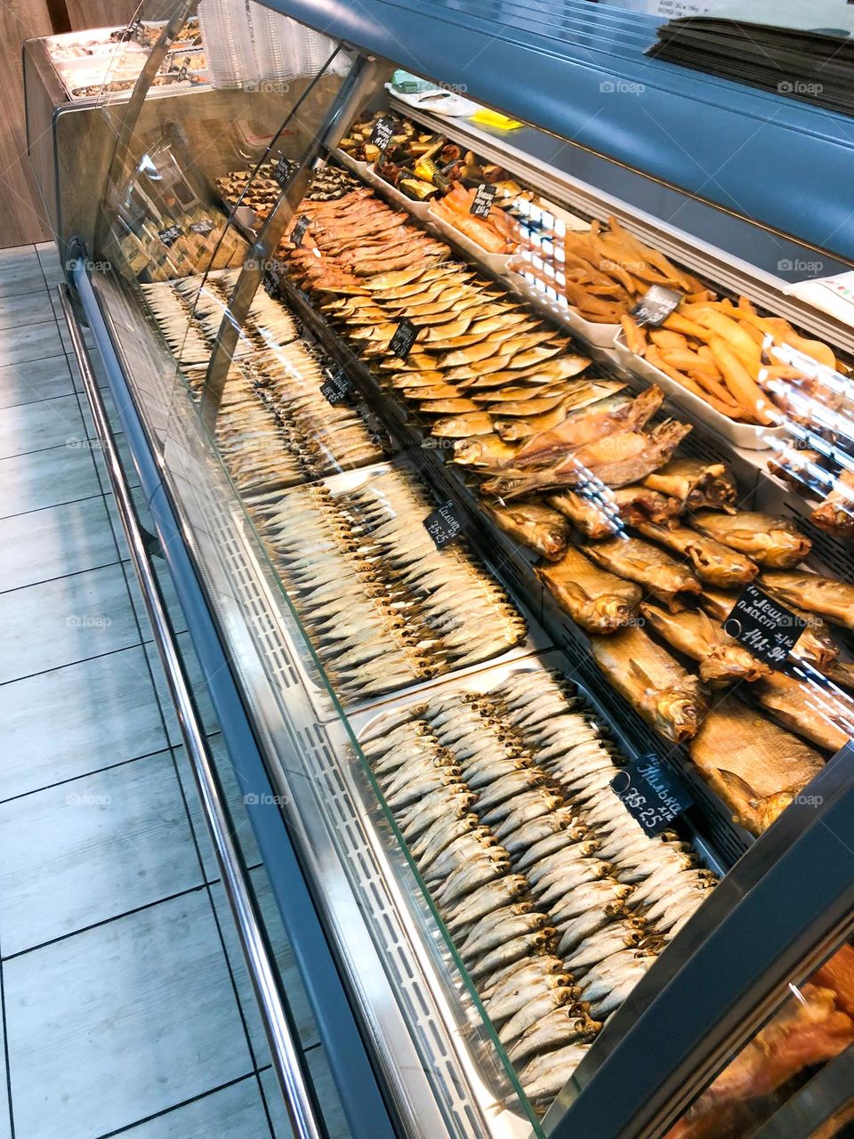 showcase with smoked fish in the store