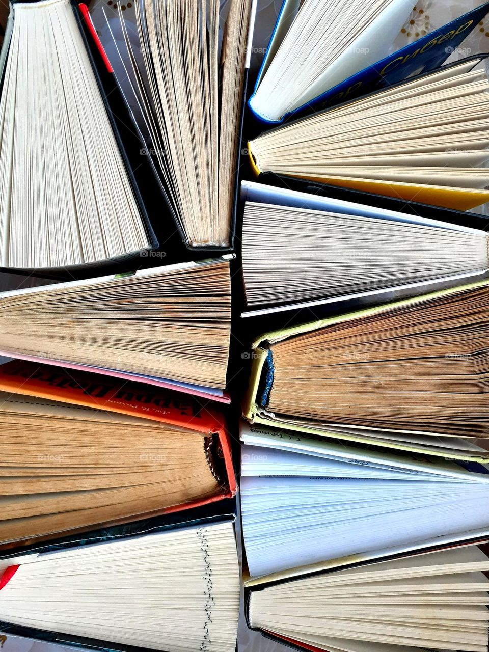 Photo of open books in a triangular shape