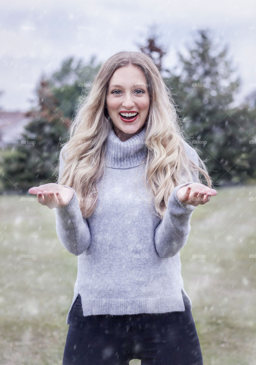 Snow falling on girl during photo shoot