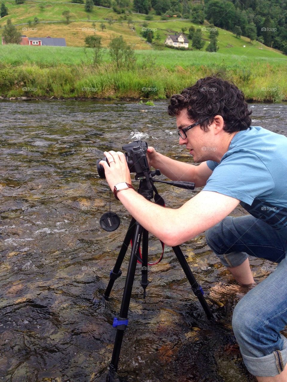 Man photographing in the river 