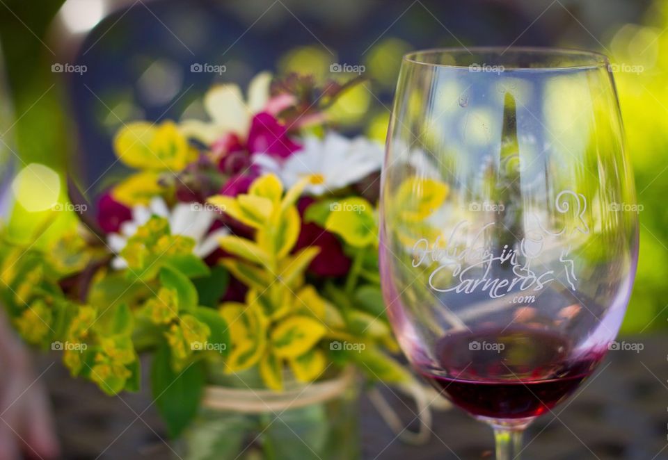 Glass of Wine and Flowers