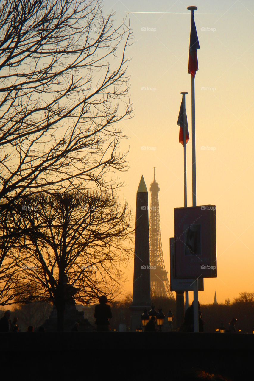 the Eiffel Tower and the Luxor Obelisk during a beautiful sunset in Paris