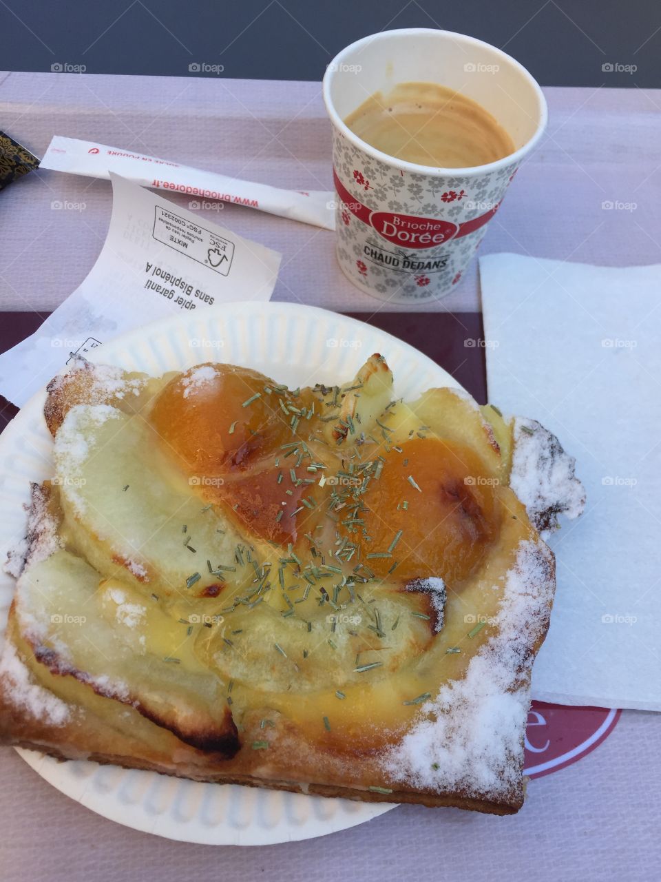 Breakfast on the go in Strasbourg France with coffee cup