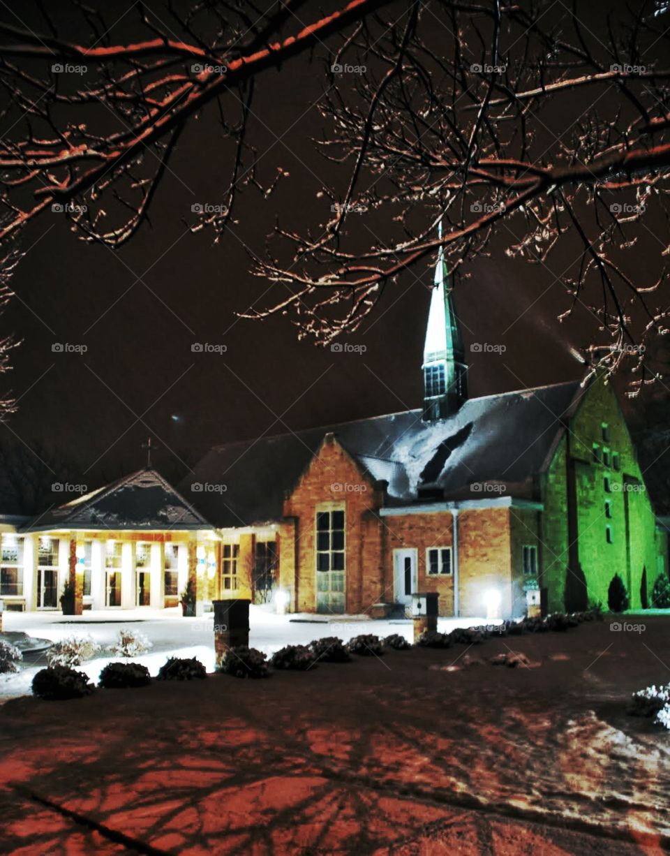Christmas night snow. A soft snow blankets a church on Christmas night
