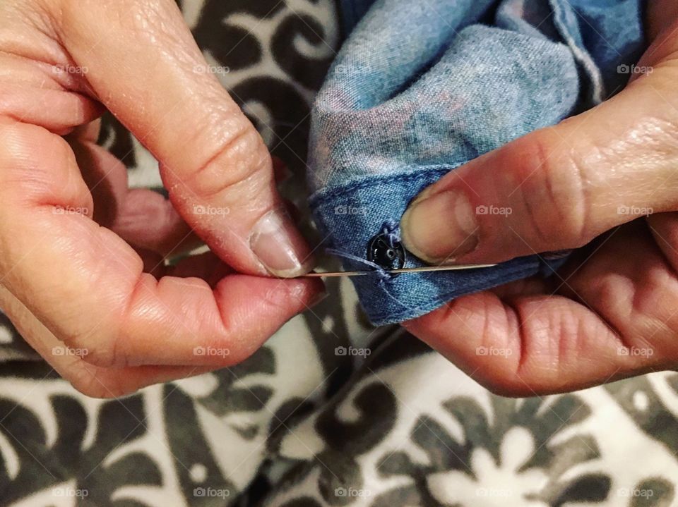 Sewing on snaps for some fall festive clothing 