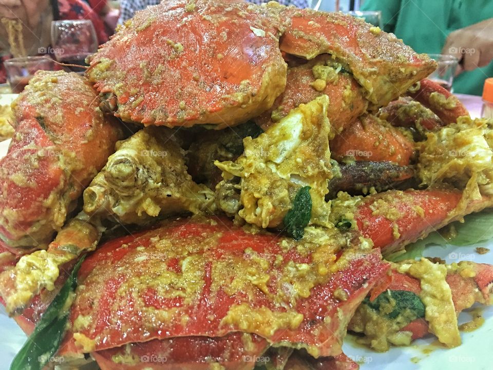 "Salted Egg Crab" a Malaysian dish of mud crabs fried in a sauce made from duck eggs preserved in salt (Chinese salted eggs), chillies and curry leaves