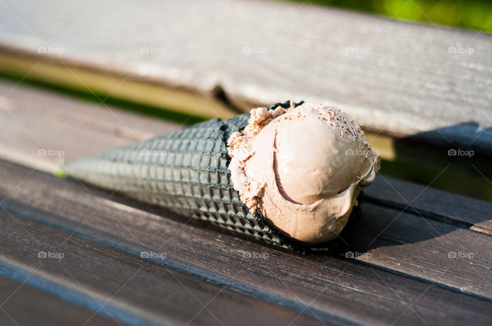 Brown ice cream on brown bench 