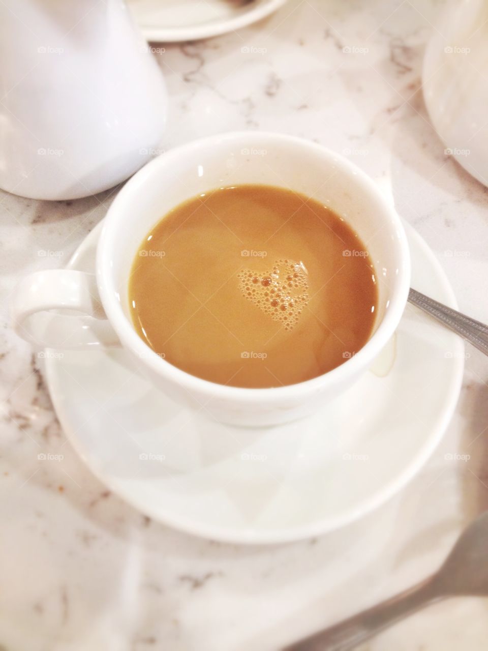 Cup of tea heart. A little frothy heart shape in a cup of tea